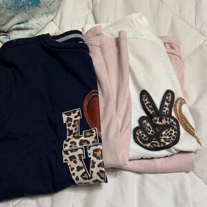 Set of Pink, White, and blue T-Shirts